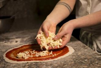 Make your own pizza in an authentic pizzeria
